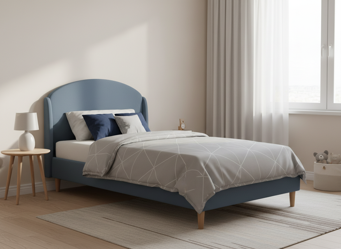 A boys' upholstered bed with a gently curved slate blue headboard and smooth arched silhouette, solid wood legs, styled in a modern bedroom.